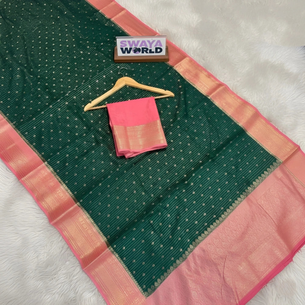 Green and pink saree with a hanger on a white background, branded 'Swaya World'.