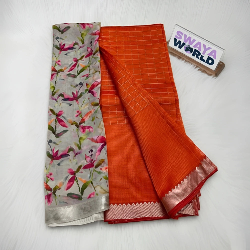 Two folded fabrics, one floral and one orange with a grid pattern, on a white surface with 'Swaya World' branding.