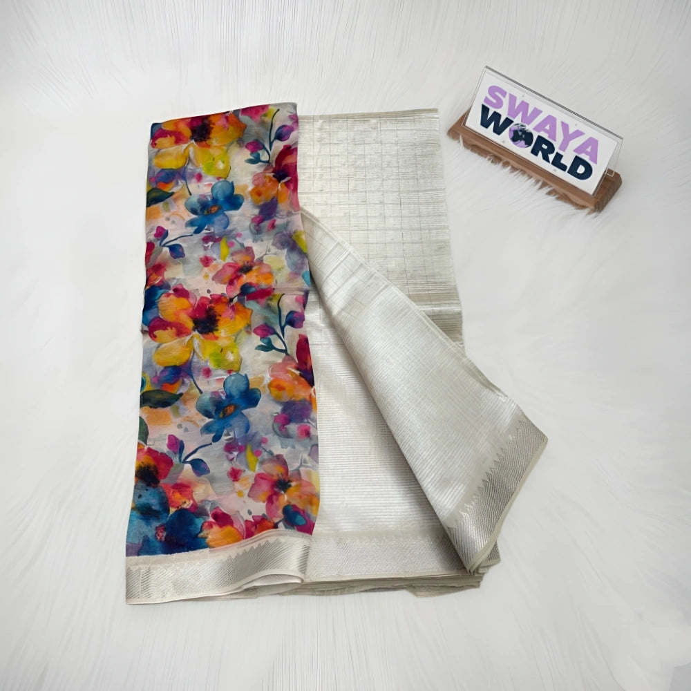 Colorful floral scarf and silver fabric with 'Swaya World' branding on a white background