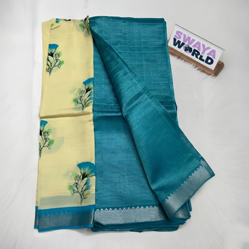 Teal saree with floral patterns on a white background, branded 'Swaya World'.