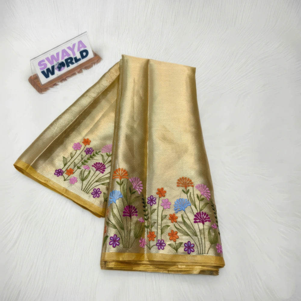 Gold saree with floral patterns on a white background, branded 'Swaya World'.
