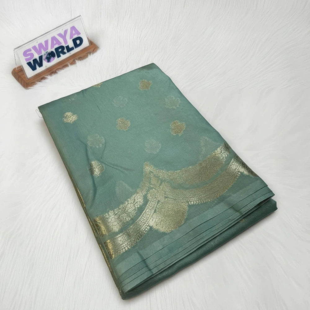 Green saree with gold patterns on a white background, branded 'Swaya World'.