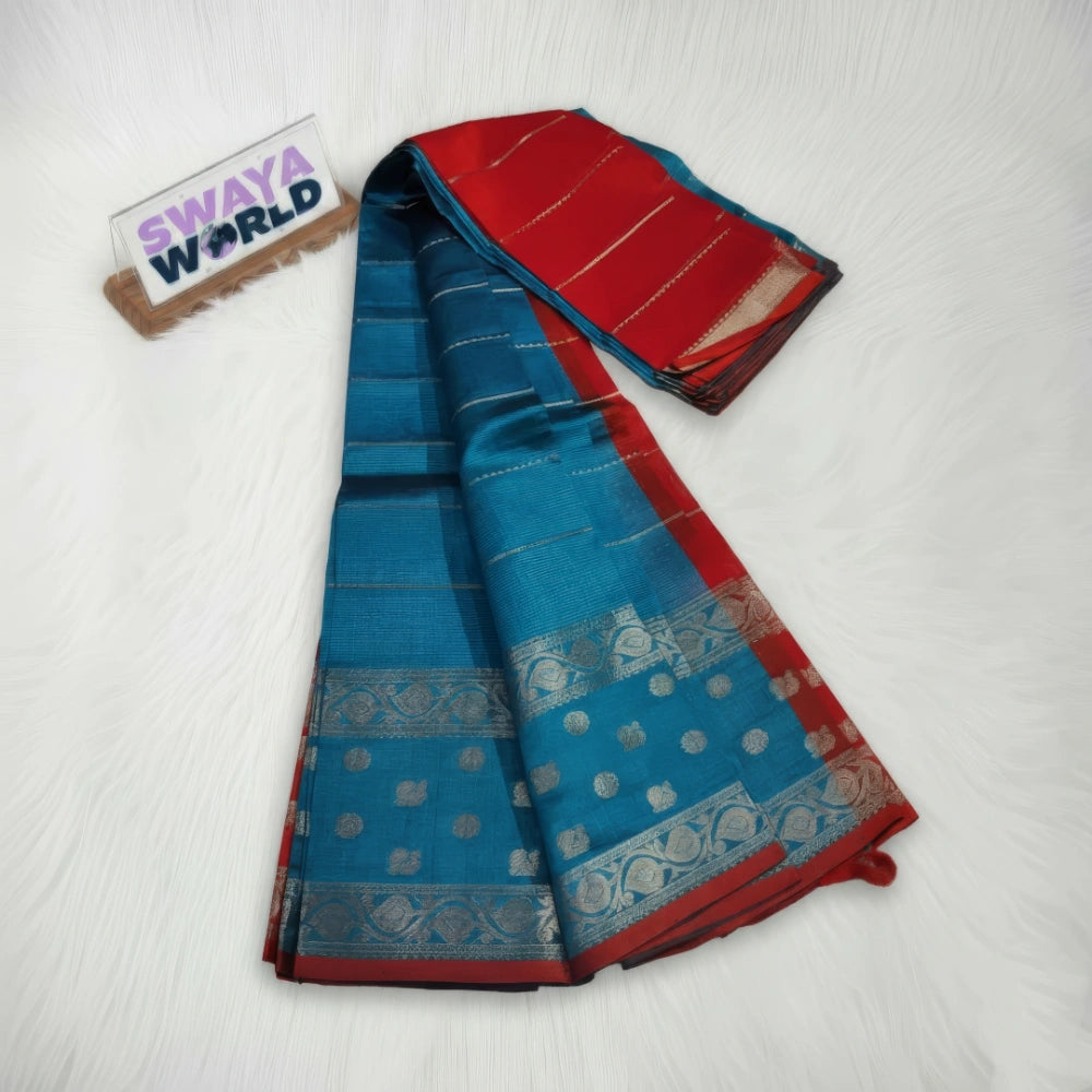 Blue and red saree with a visible brand logo on a white background