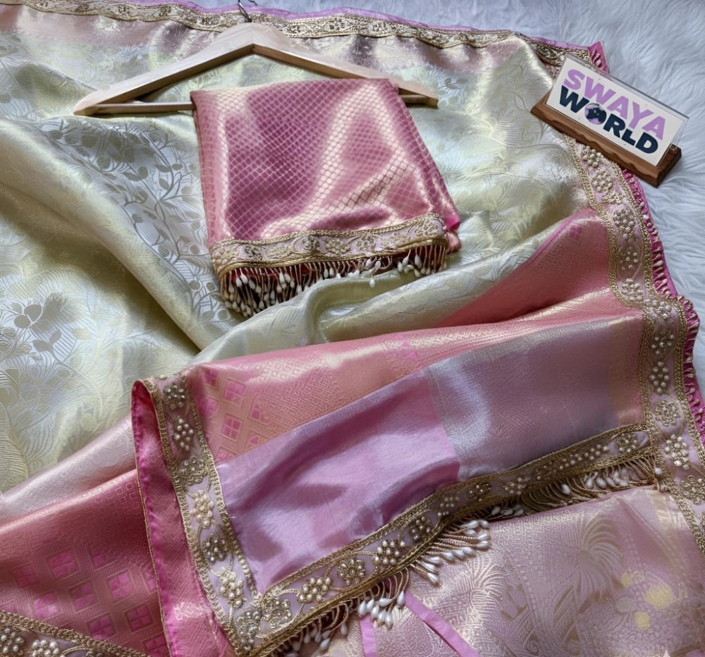 Pink saree with gold border on a white background, branded 'Swaya World'.