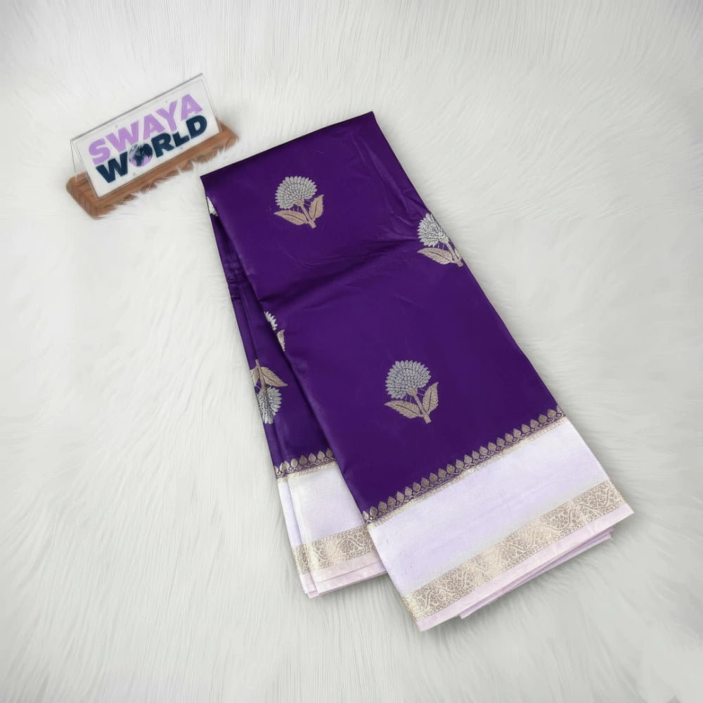 Purple saree with white border and floral patterns on a light gray background, branded 'Swaya World'.