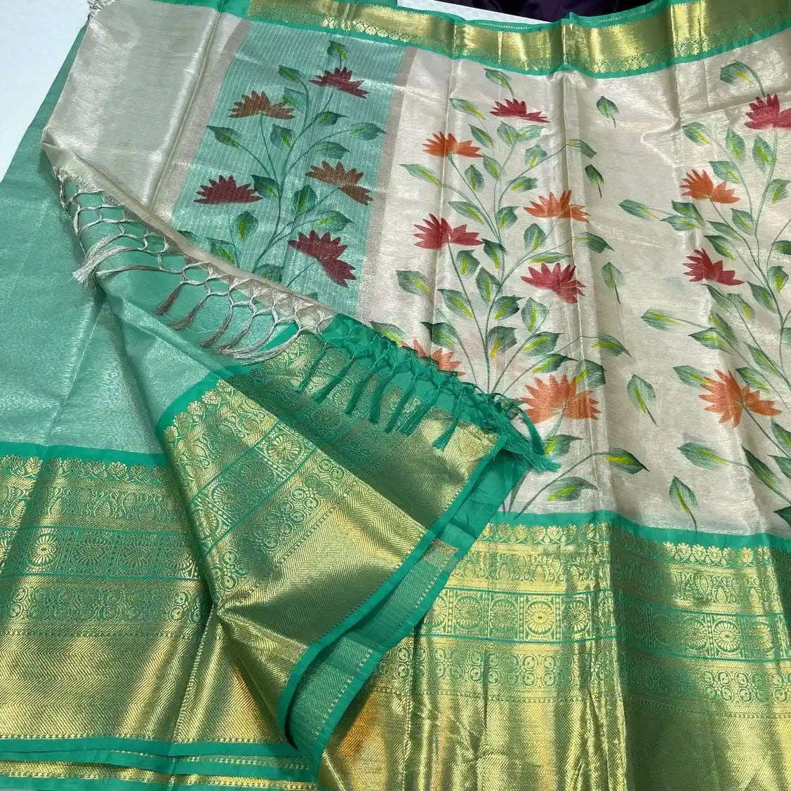 Traditional saree with floral patterns and green border