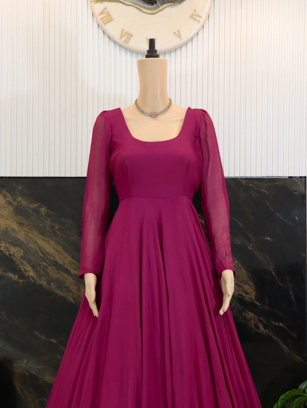 Close front view of Magenta georgette long frock with sheer sleeves, fitted bodice, and full flared skirt.