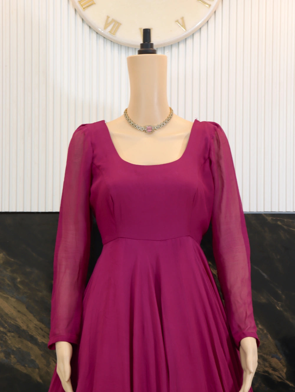 Front Close view of Magenta georgette long frock with sheer sleeves, fitted bodice, and full flared skirt
