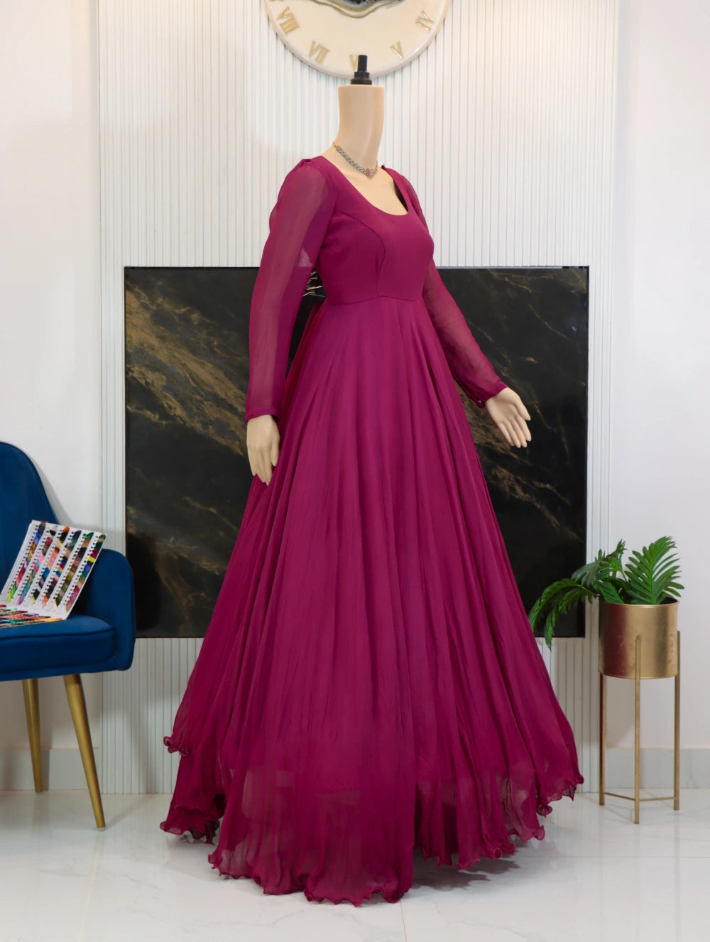 Side view of Magenta georgette long frock with sheer sleeves, fitted bodice, and full flared skirt
