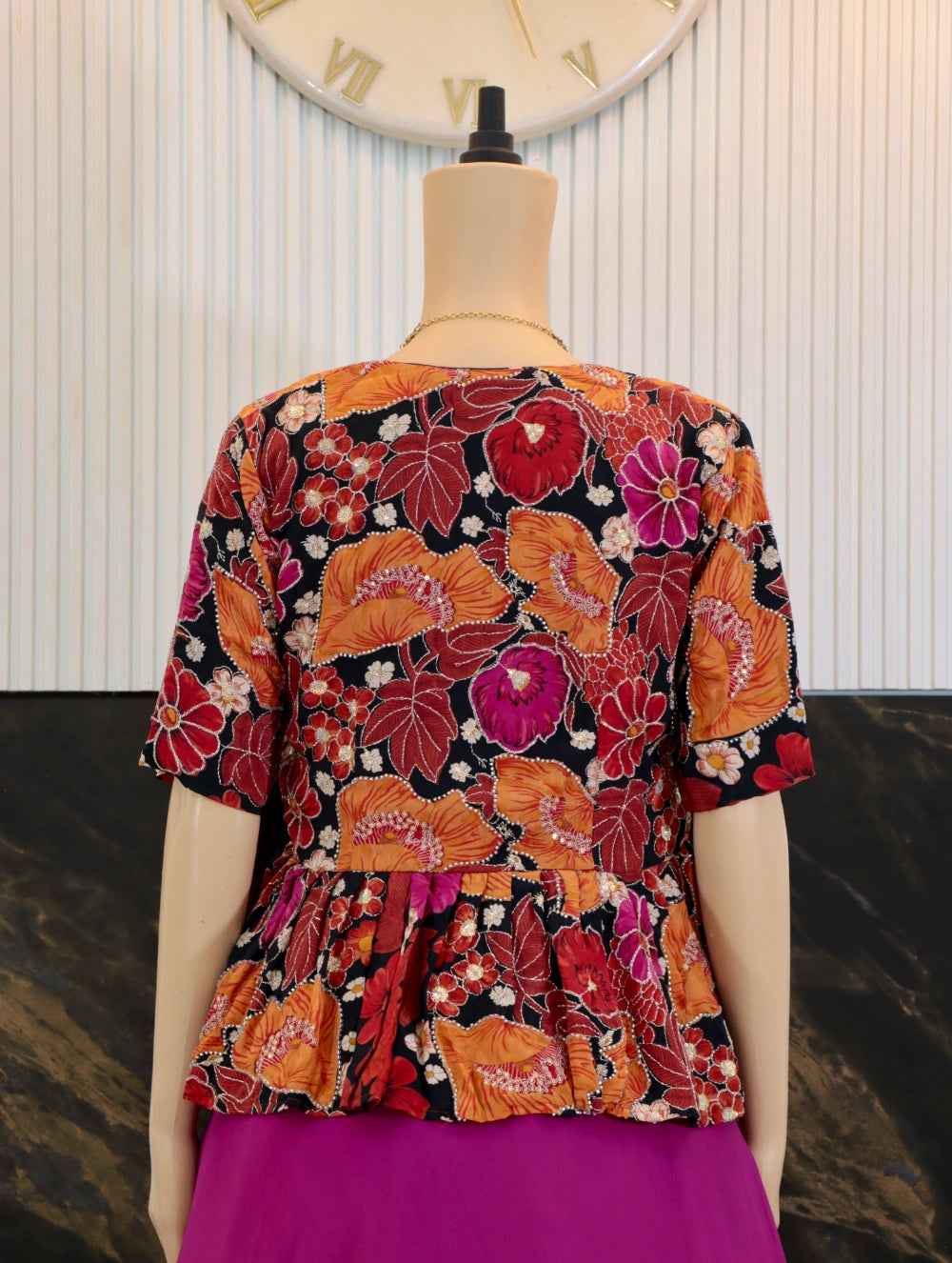 Pink georgette gown with corset lace-up back and autumn tapestry peplum coat – back close view