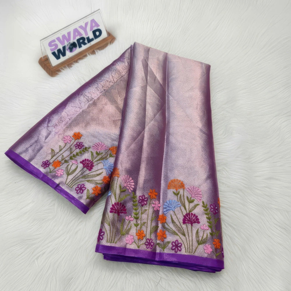 Purple color folded sarees with floral patterns on a white surface, branded 'Swaya World'.