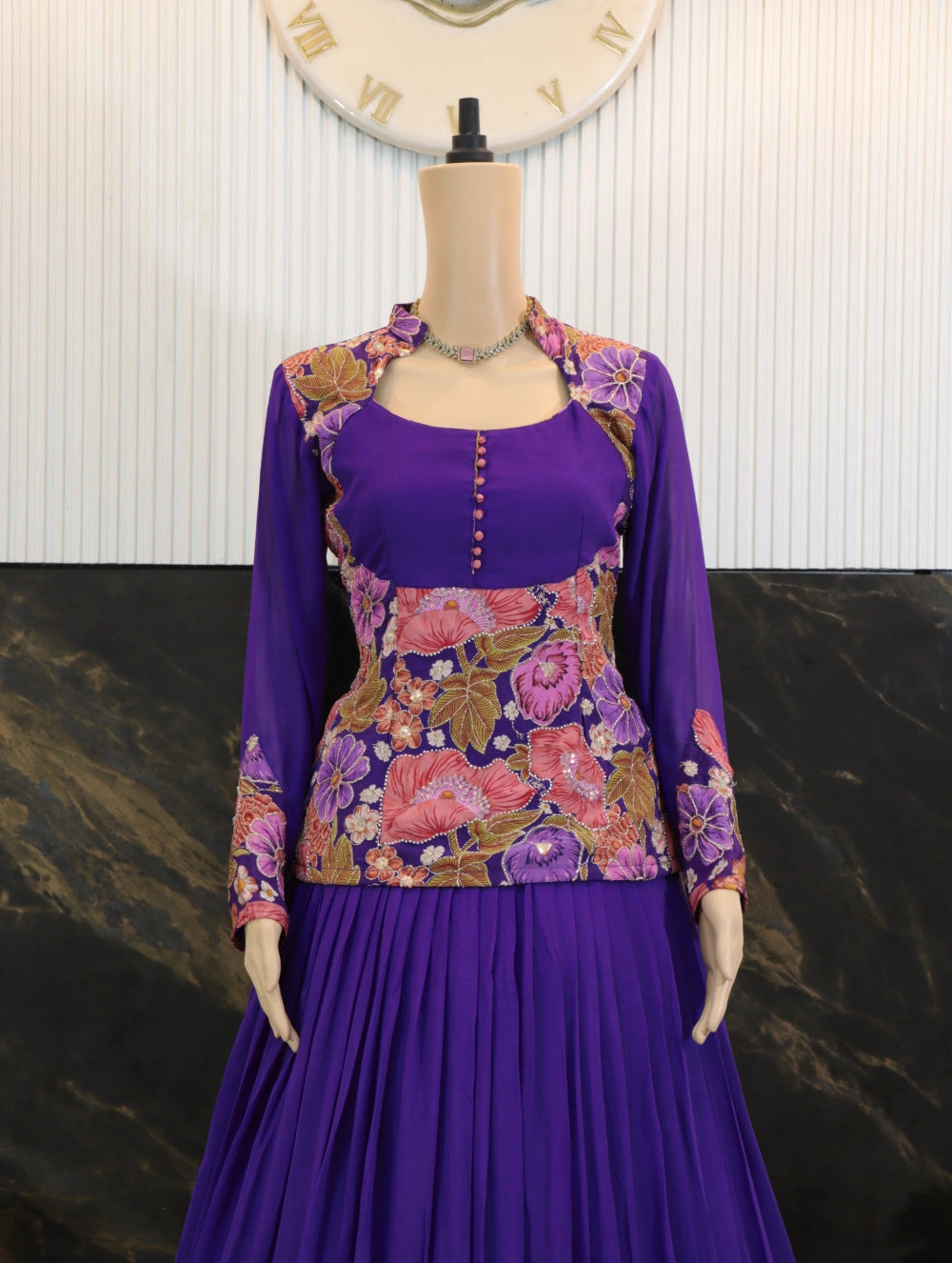 Close-up of embroidered floral jacket over viscose crepe peplum top with cutdana handwork