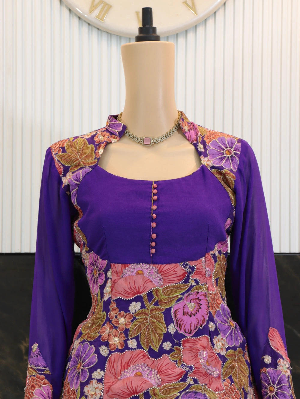 Close-up of Purple embroidered floral jacket over viscose crepe peplum top with cutdana handwork