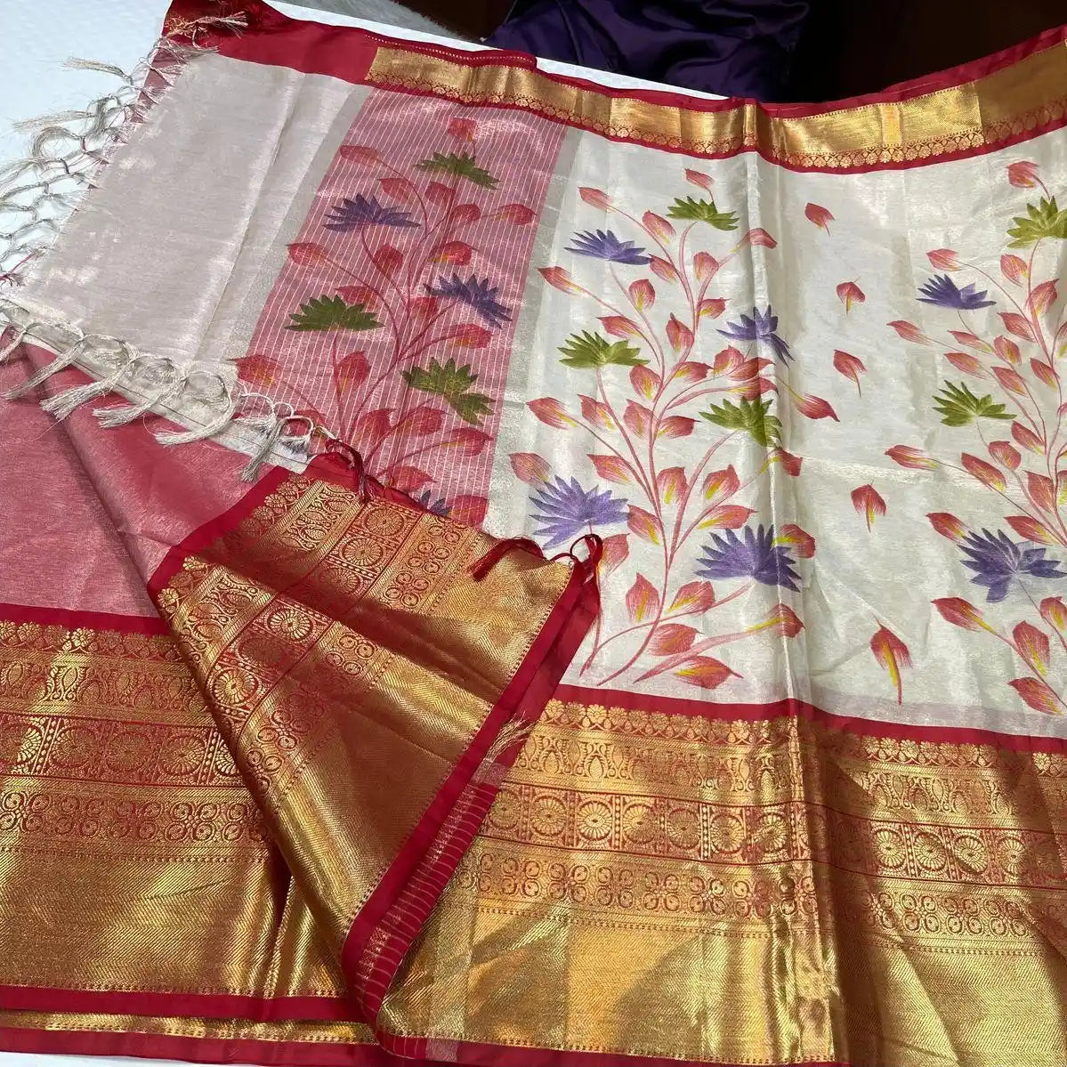 Saree with floral patterns and red & gold border