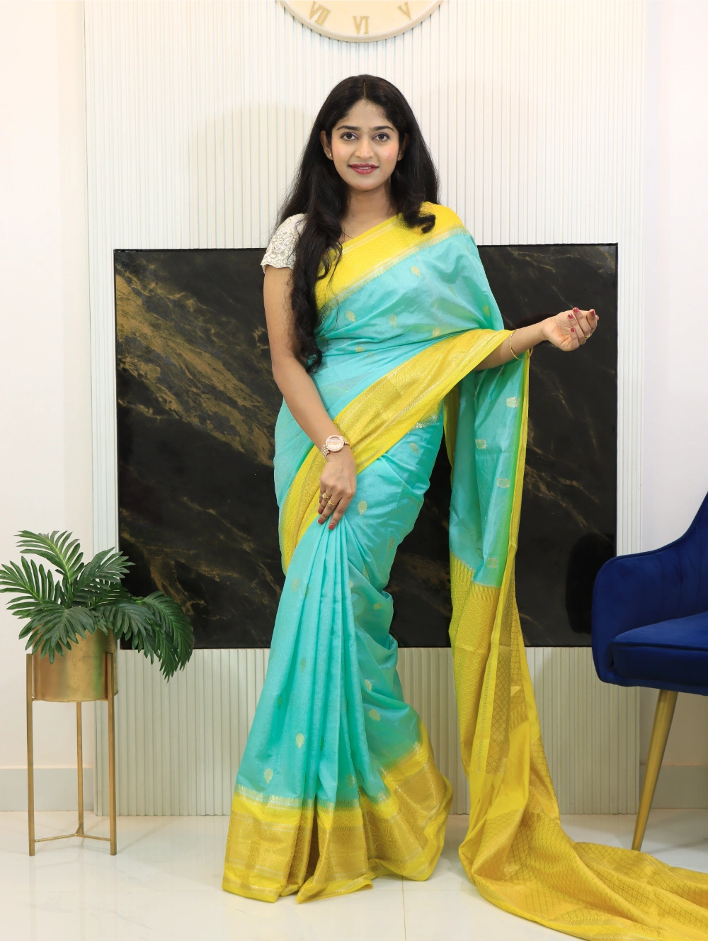 Teal blue Pure Premium Banarasi Katan Dyble silk saree with mustard yellow Paithani-style border, golden zari motif butis, rich jacquard pallu, and matching brocade blouse piece traditional Indian festive wear